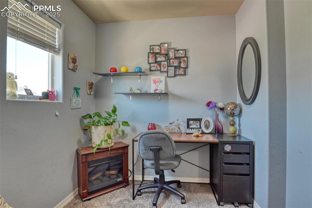 Image 31 of 43: Office space with carpet and baseboards