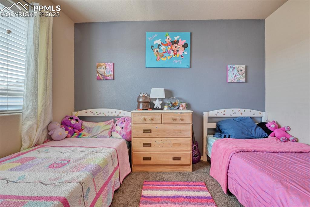 Image 36 of 43: Bedroom with carpet floors