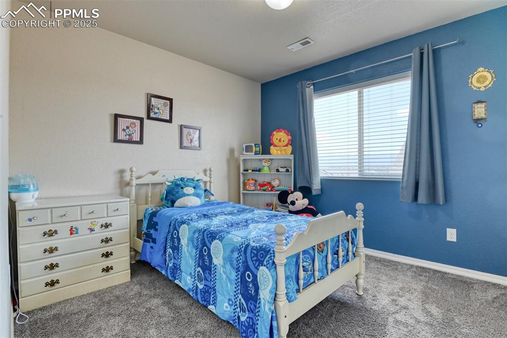 Image 40 of 43: Bedroom featuring carpet and baseboards