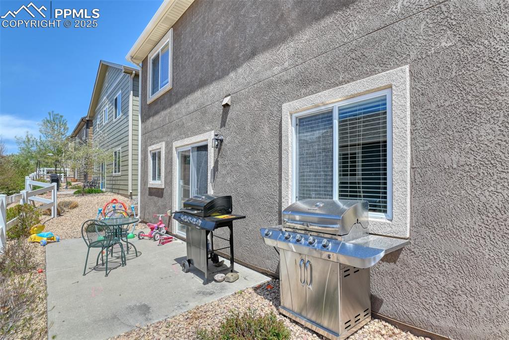 Image 7 of 43: View of patio with a grill