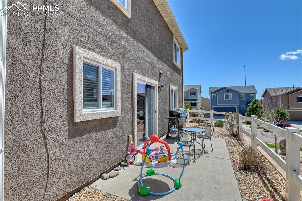 Image 8 of 43: View of patio / terrace with a grill and a residential view