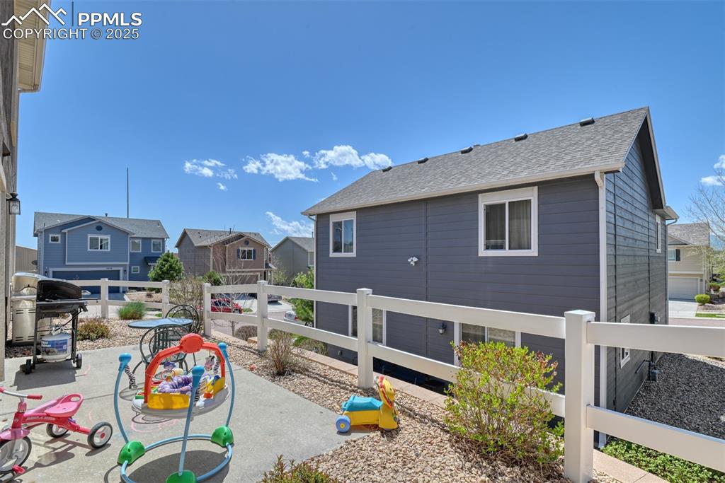 Image 9 of 43: View of patio / terrace featuring a grill and a residential view