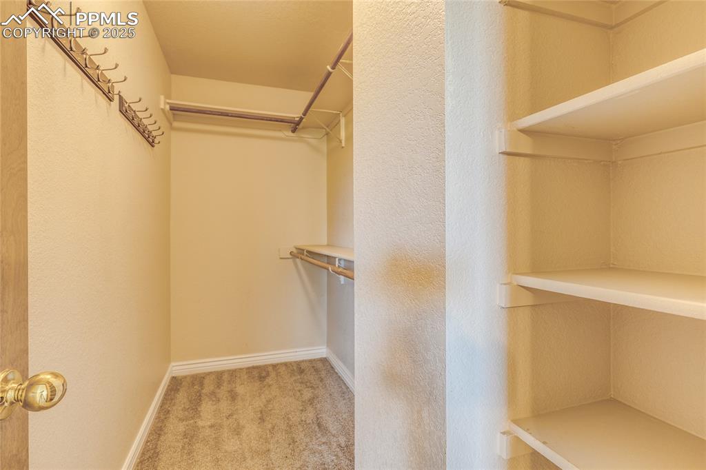Image 21 of 46: Master bedroom walk in closet