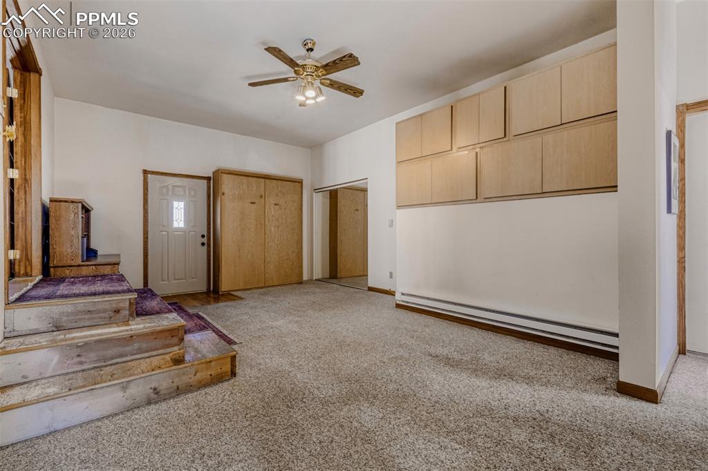 Image 15 of 34: Flex space with Murphy bed, cabinets, closet and separate entrance.