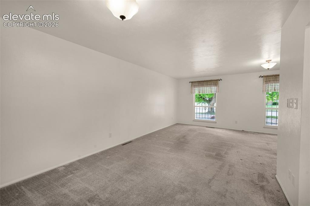 Image 13 of 50: Looking From Dining Area To Living Room