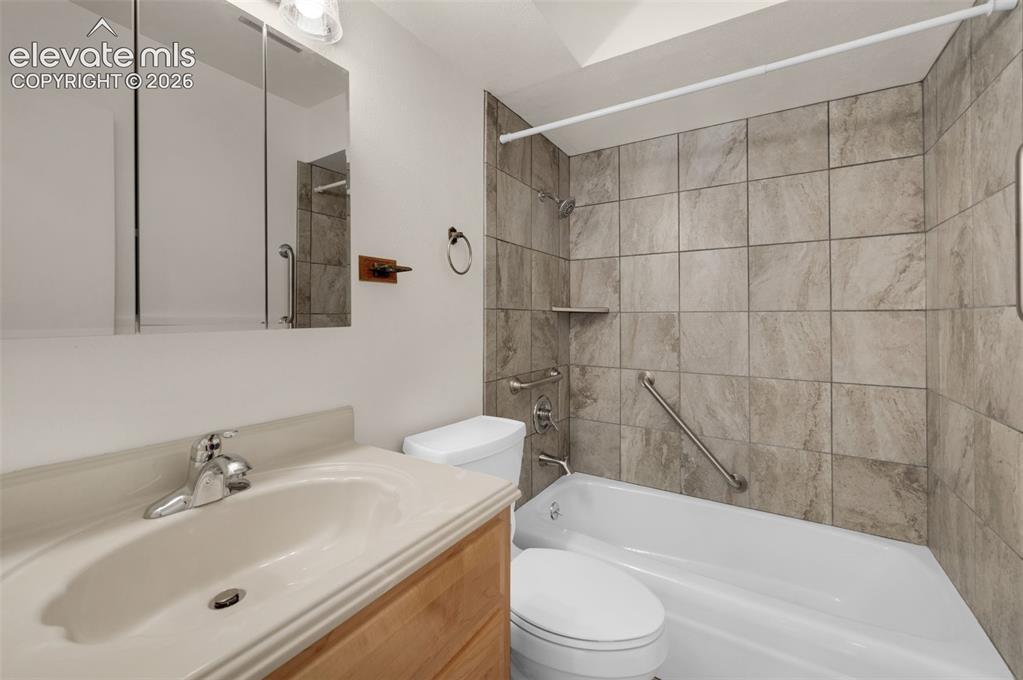 Image 32 of 50: Remodeled Full Bath In Hall Of Upper Level