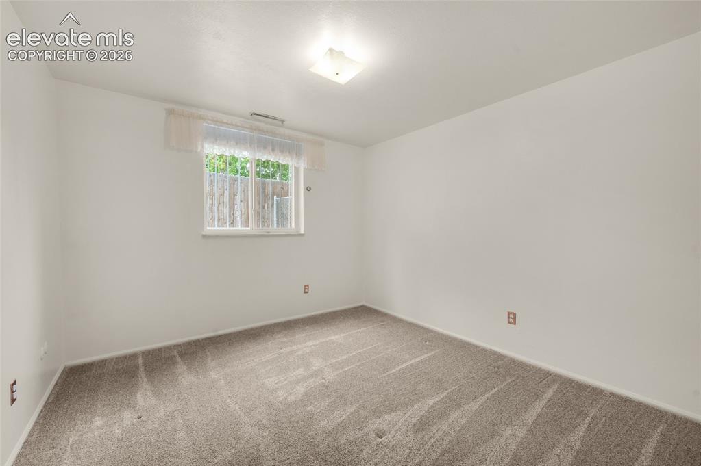Image 40 of 50: Lower Level Bedroom Could Be Used As An Office