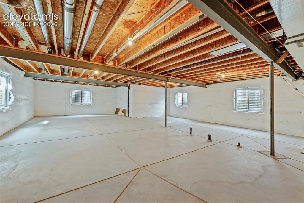 Image 36 of 49: four egress windows, rough-in plumbing