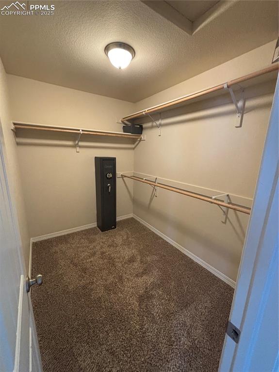 Image 24 of 46: Spacious master closet