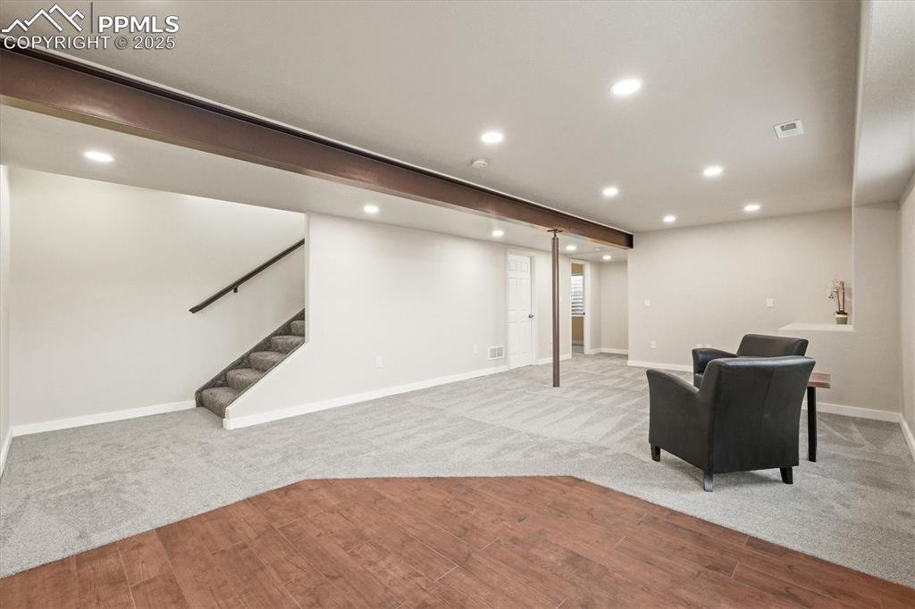 Image 30 of 46: Finished basement featuring recessed lighting, visible vents, tile floors,