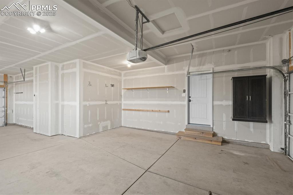 Image 35 of 46: Garage with a garage door opener