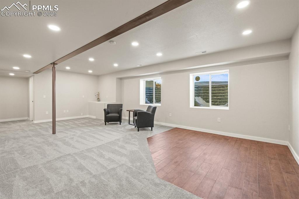 Image 7 of 46: Unfurnished room featuring light wood-style flooring, baseboards, and reces
