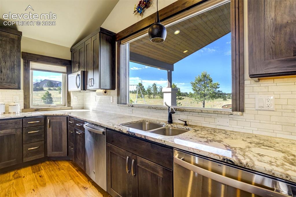 Image 16 of 50: Gourmet kitchen with 2 dishwashers