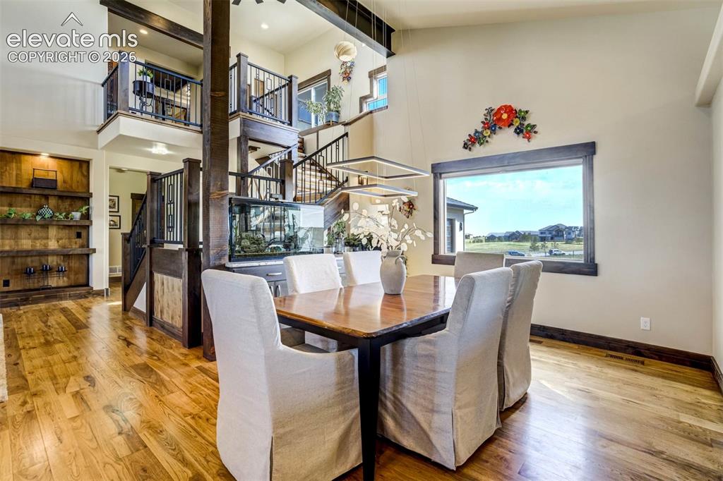 Image 19 of 50: Formal dining features built-in buffet with sink