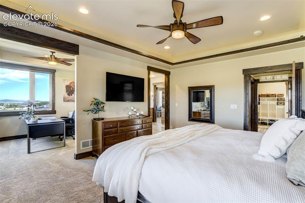 Image 26 of 50: Master suite with private office space