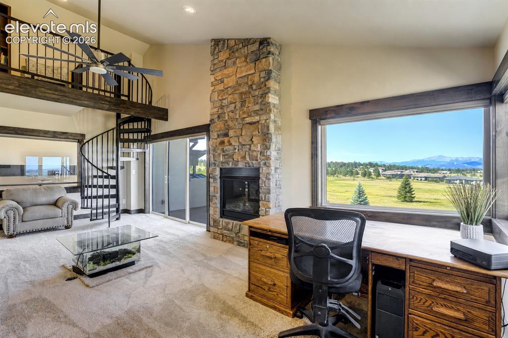 Image 31 of 50: 2nd floor Family/Flex room with lofted reading nook, private deck, gas fire