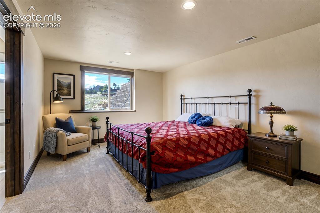 Image 40 of 50: Basement guest suite with private attached bath