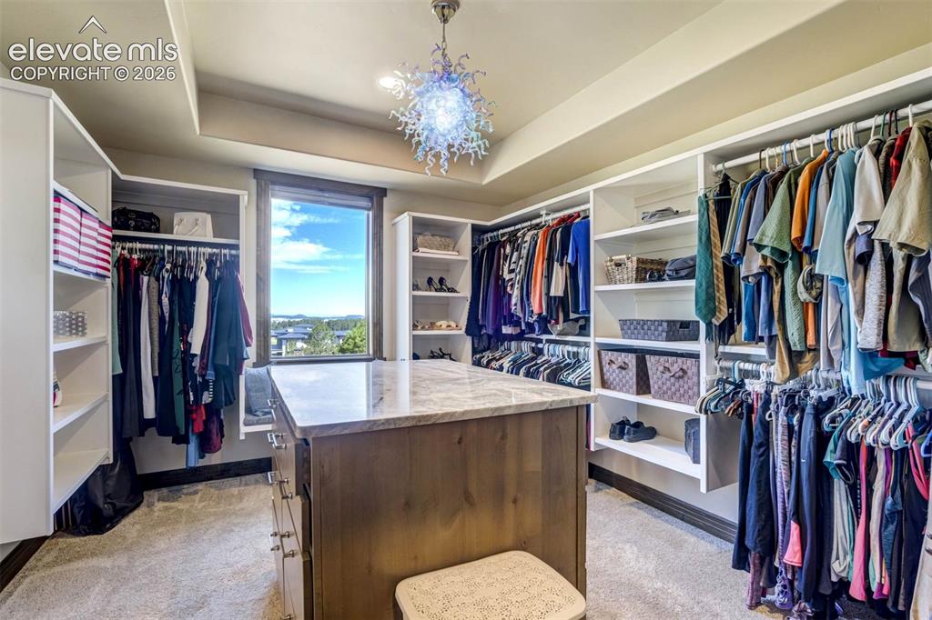 Image 8 of 50: Master closet with direct access to laundry/mudroom