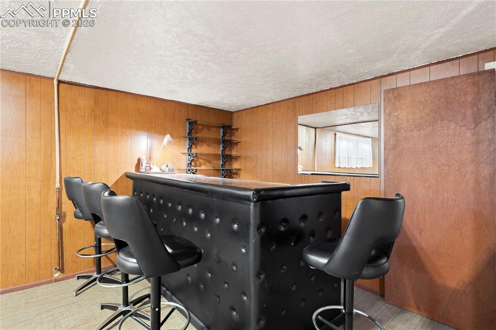 Image 21 of 42: bar in basement family room