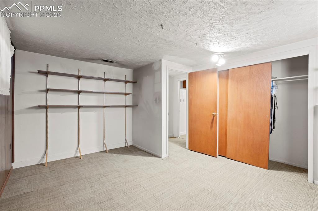 Image 26 of 42: bedroom in basement