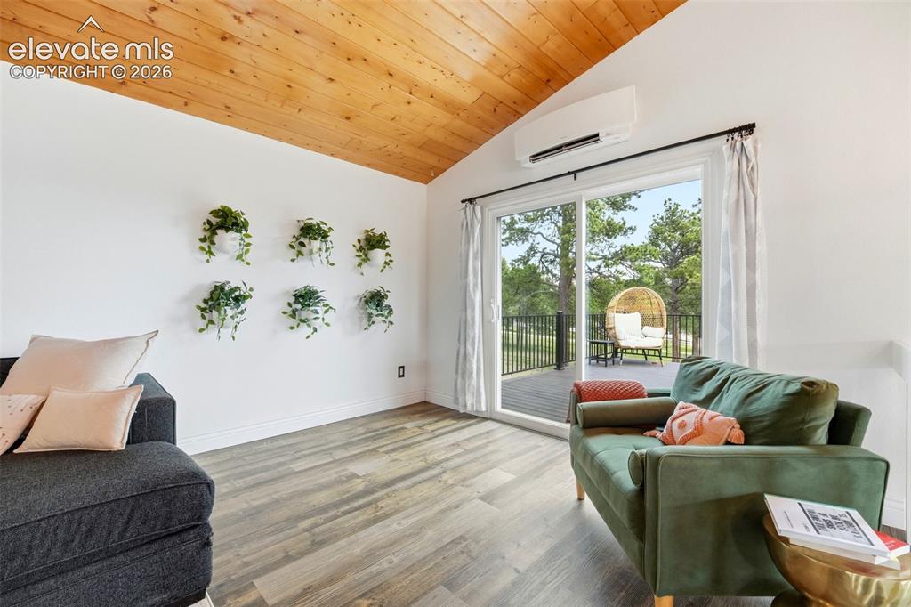 Image 17 of 50: Sunlight-filled open floor plan with updated windows and doors
