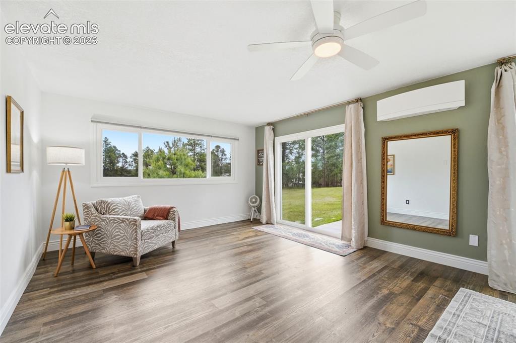 Image 20 of 50: Open-concept main floor with seamless deck access