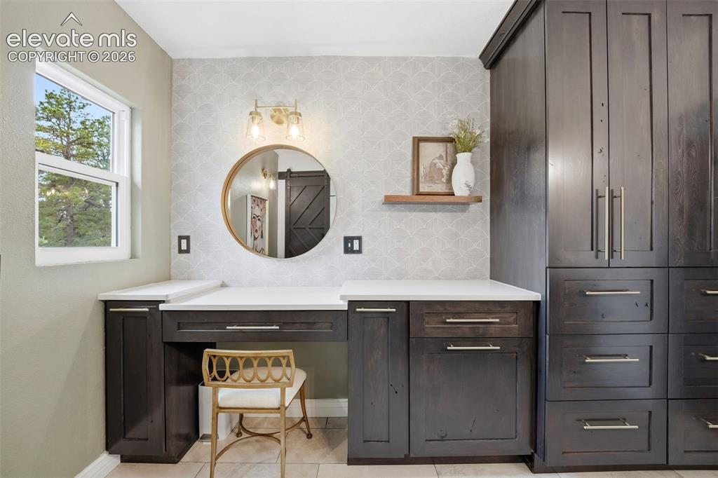 Image 24 of 50: Spacious primary suite with a private walk-out to the hot tub