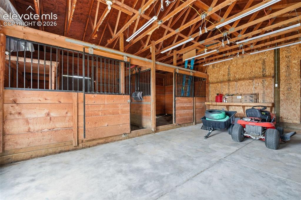 Image 44 of 50: Bonus basement room with direct access to a newly poured concrete patio