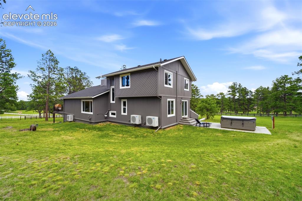 Image 46 of 50: All-purpose outbuilding offers a 2-stall barn and a concrete garage/worksho