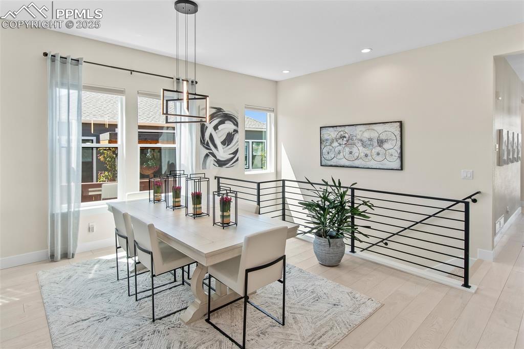Image 15 of 48: Dining area featuring light wood-type flooring and recessed lighting