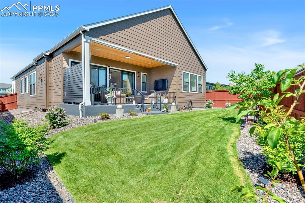 Image 3 of 48: Back of house with a patio area