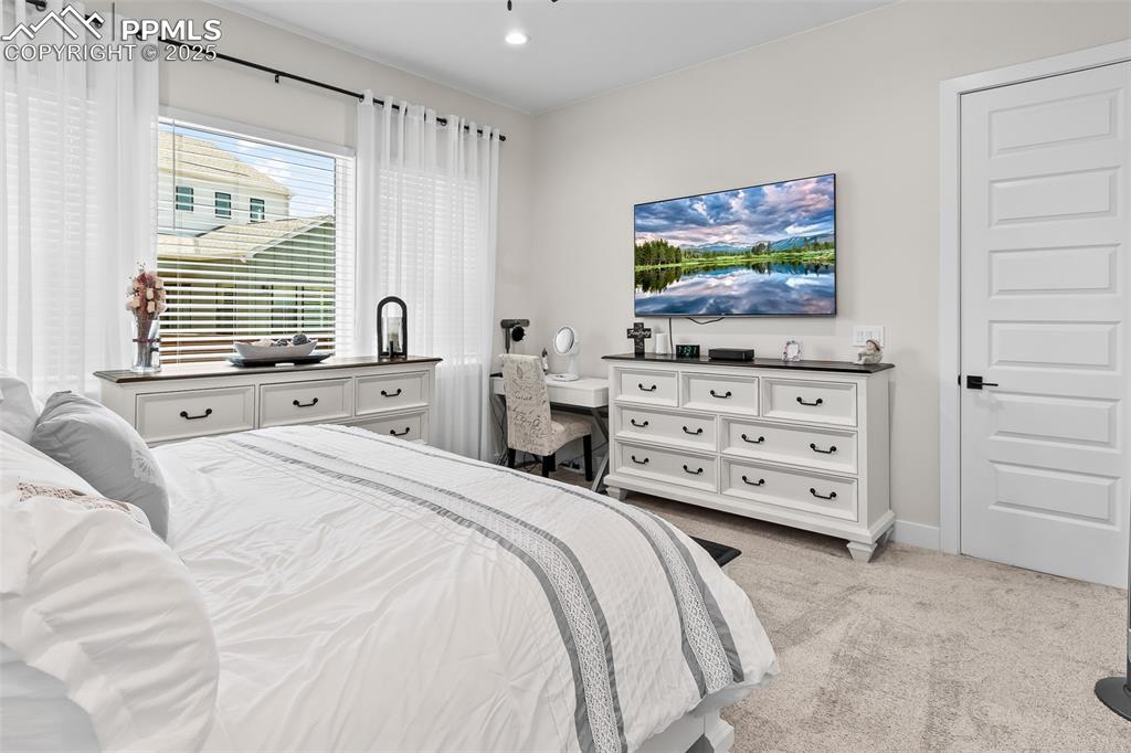 Image 31 of 48: Bedroom featuring light colored carpet and baseboards
