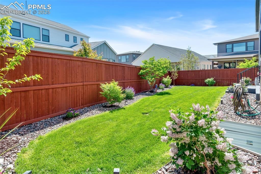 Image 4 of 48: Fenced backyard featuring a residential view