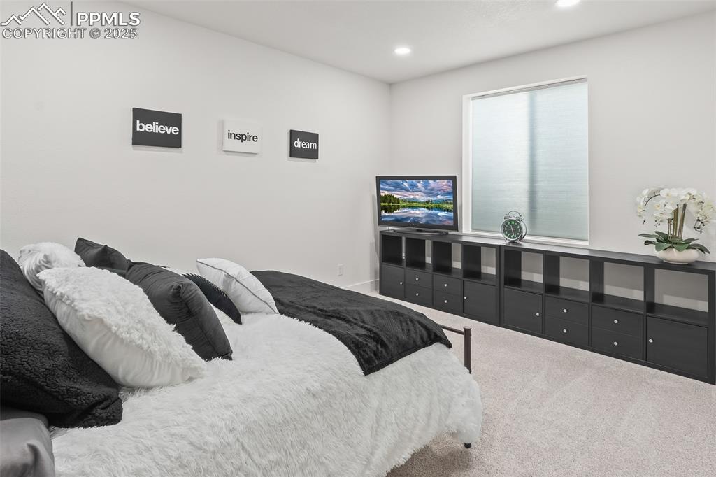 Image 41 of 48: Bedroom with carpet floors and recessed lighting