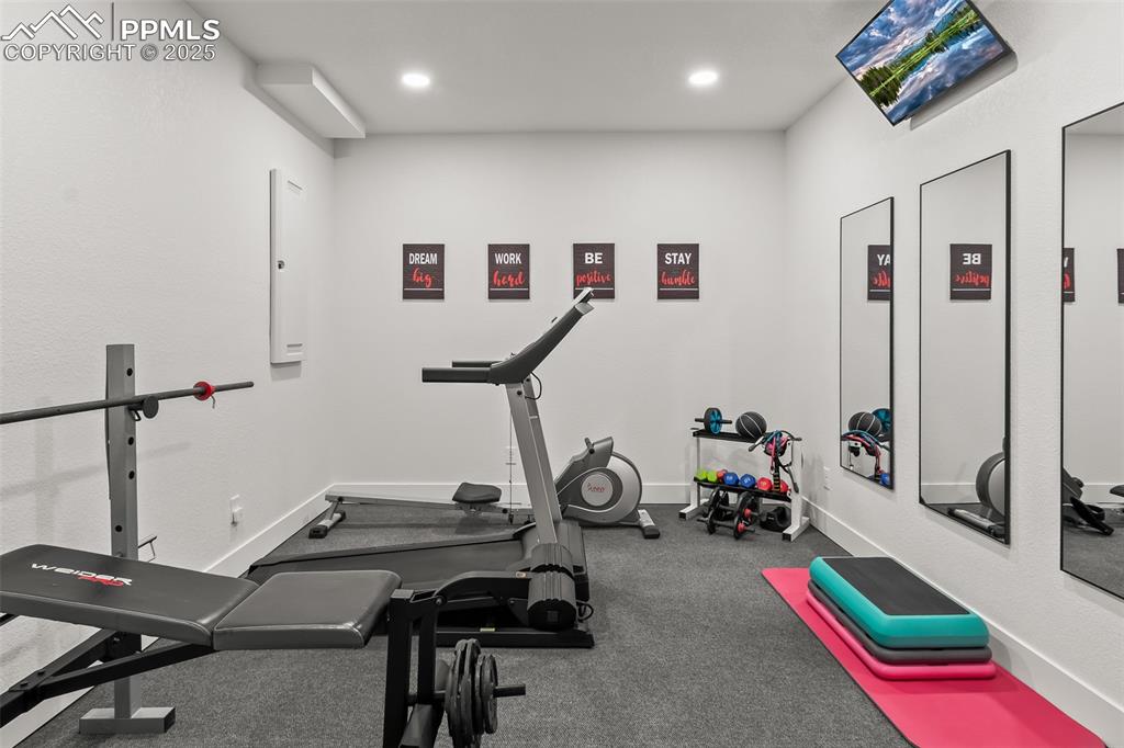Image 45 of 48: Workout room featuring electric panel and recessed lighting