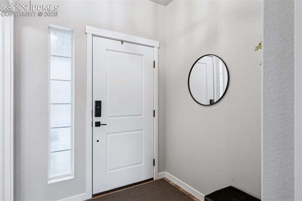 Image 13 of 39: Covered Entry opens to Welcoming Foyer