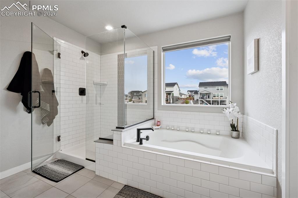 Image 21 of 39: Garden Tub and Glass Enclosed Shower