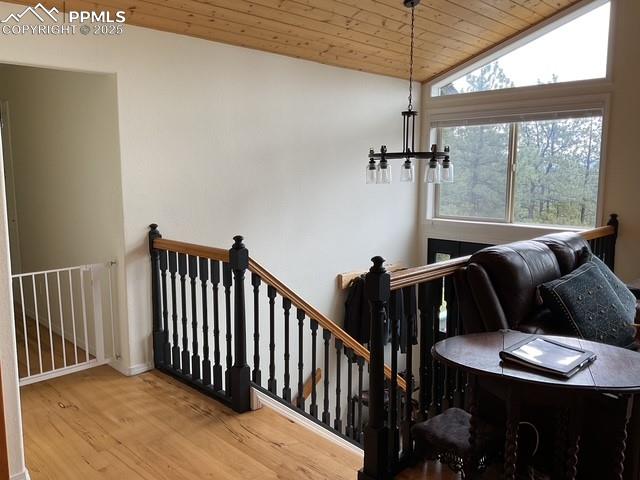 Image 17 of 39: Staircase featuring wood finished floors, wood ceiling, and vaulted ceiling