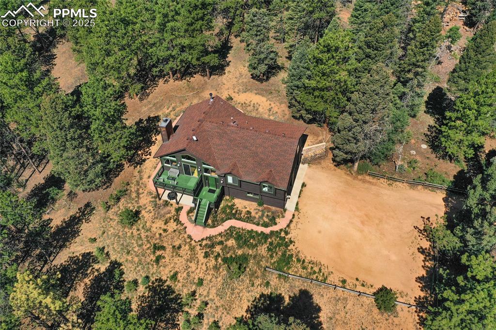 Image 9 of 39: Aerial view of property and surrounding area