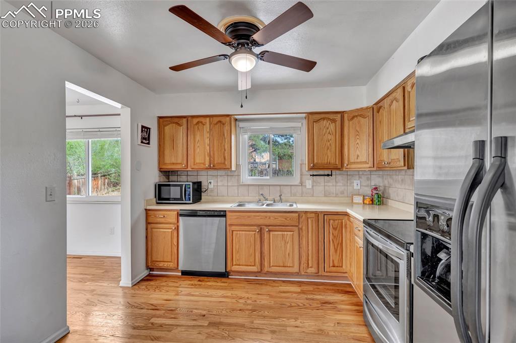 Image 10 of 31: Hardwood flooring, Stainless steel appliances