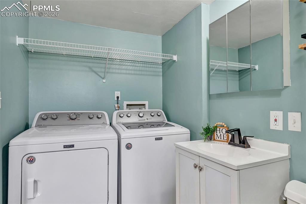 Image 15 of 31: Laundry within primary bath