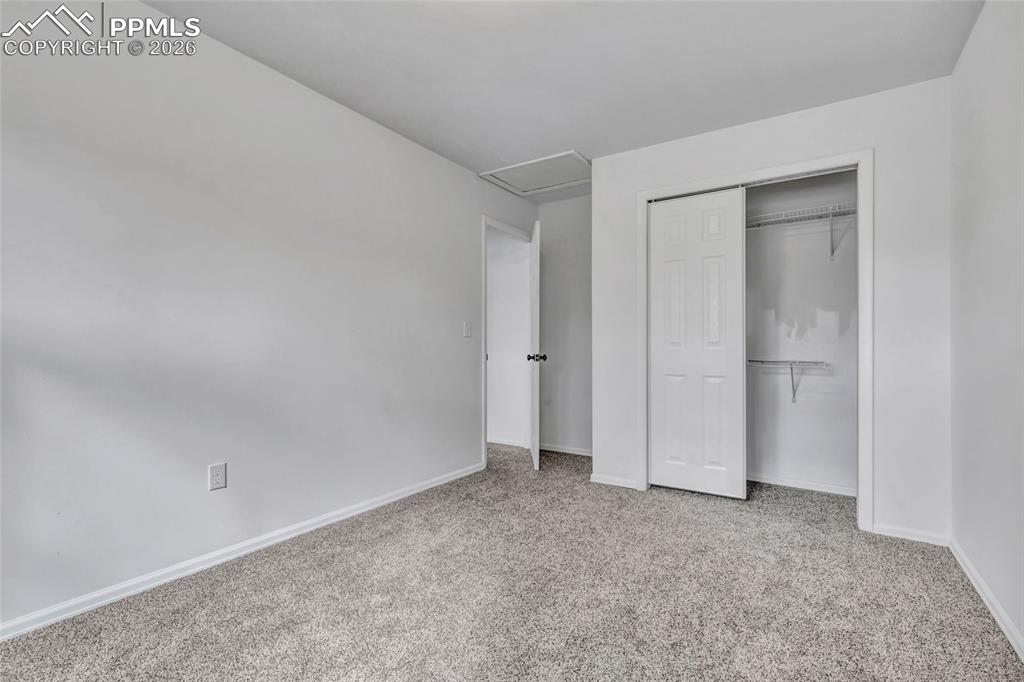 Image 22 of 31: Bedroom 3, carpet, updated window coverings
