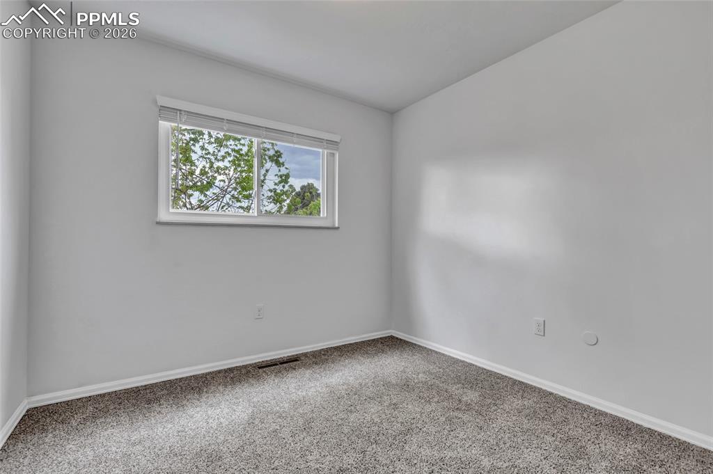 Image 24 of 31: Bedroom 4, carpet, updated window coverings
