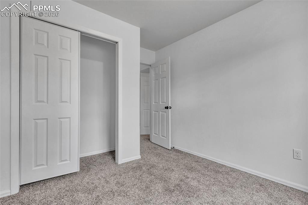 Image 25 of 31: Bedroom 4 , carpet, updated window coverings