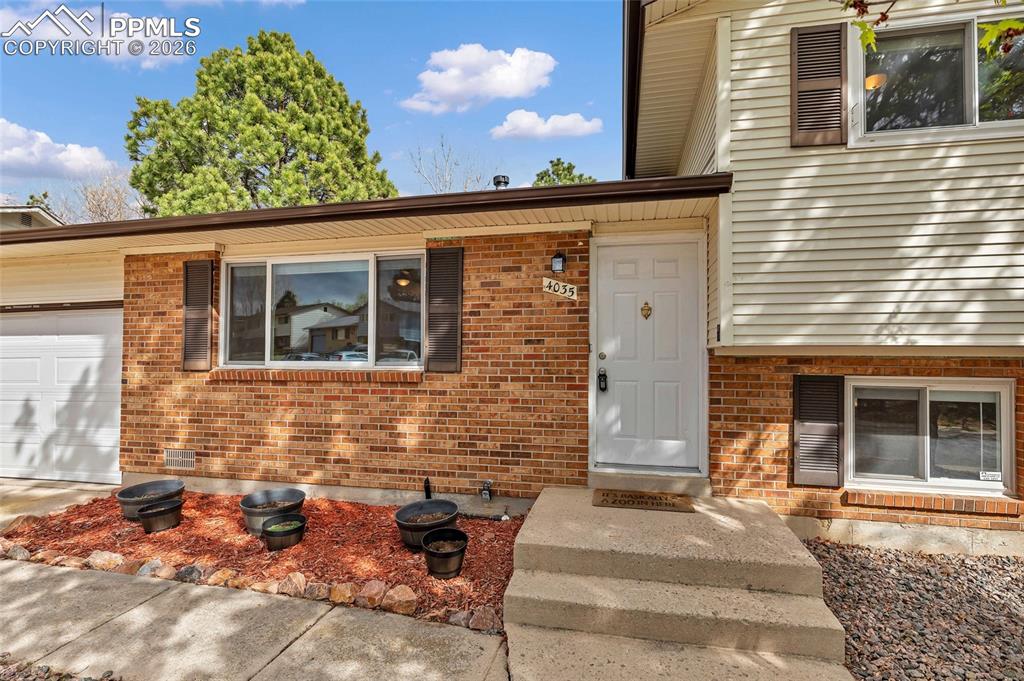 Image 31 of 31: Welcome home! Xeriscaped with flower beds