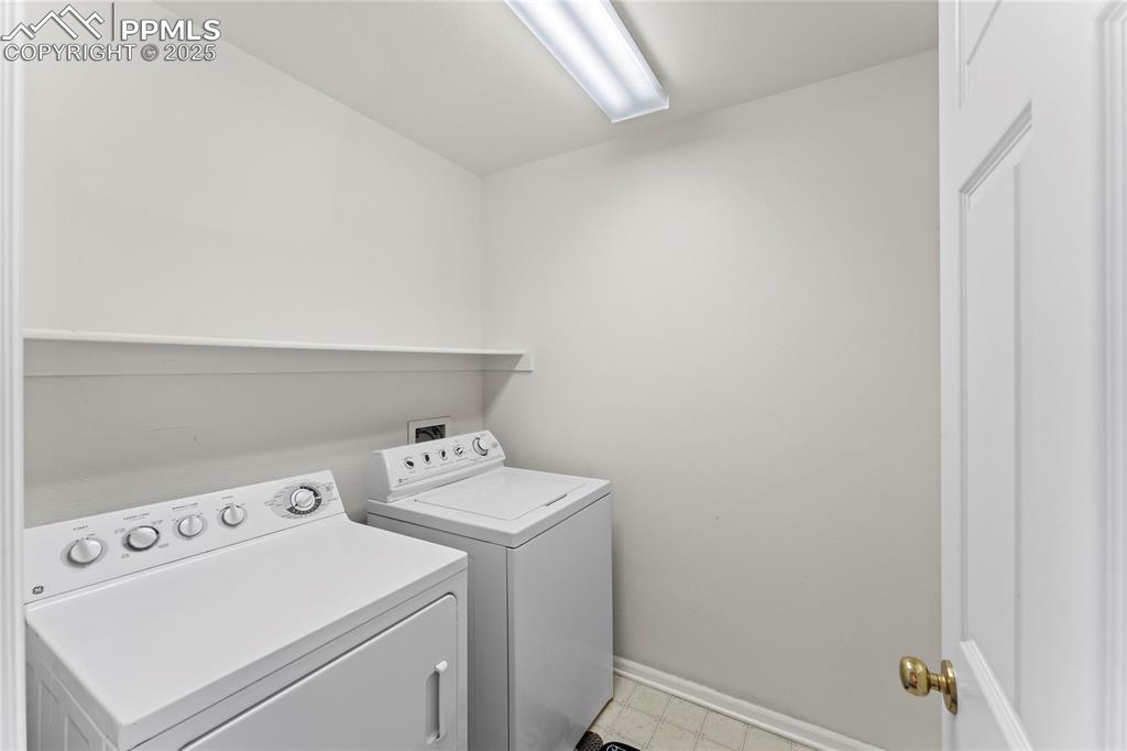 Image 29 of 49: Laundry area with independent washer and dryer