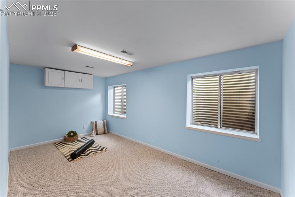 Image 43 of 49: Empty room featuring carpet floors