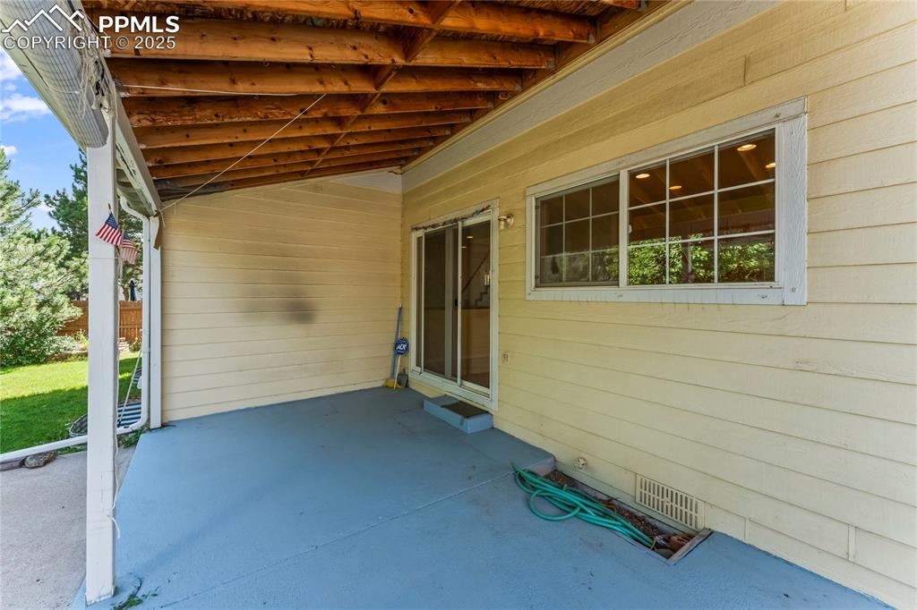 Image 47 of 49: Covered Patio and pond