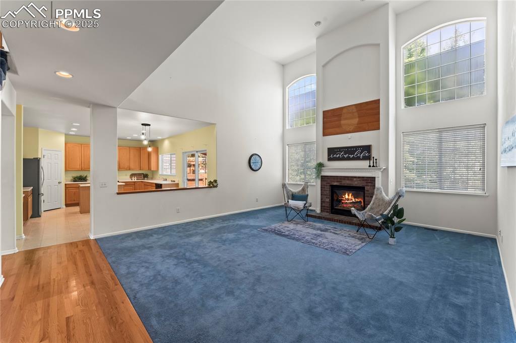 Image 8 of 49: Living area featuring open concept to kitchen