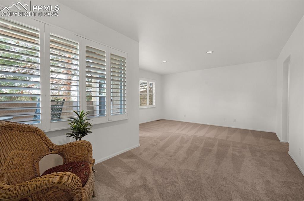 Image 20 of 50: Sitting Room within main level Primary Bedroom